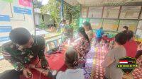 Satgas Yonif 144/JY Bersama Nakes Puskesmas Sosialisasikan Prokes dan Gelar Pengobatan Gratis di Perbatasan